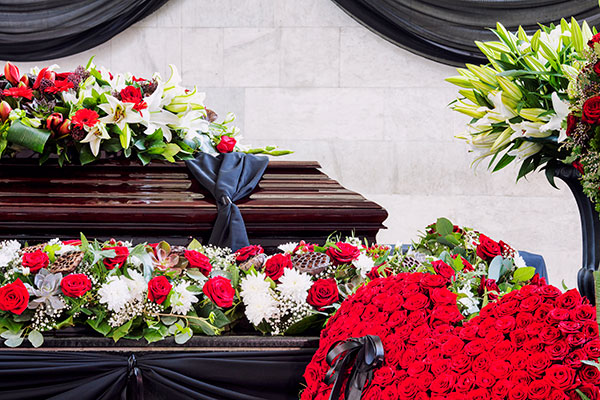funeral-beautifully-decorated-with-flower-arrangements-coffin-close-up funeral-beautifully-decorated-with-flower-arrangements-coffin-close-up