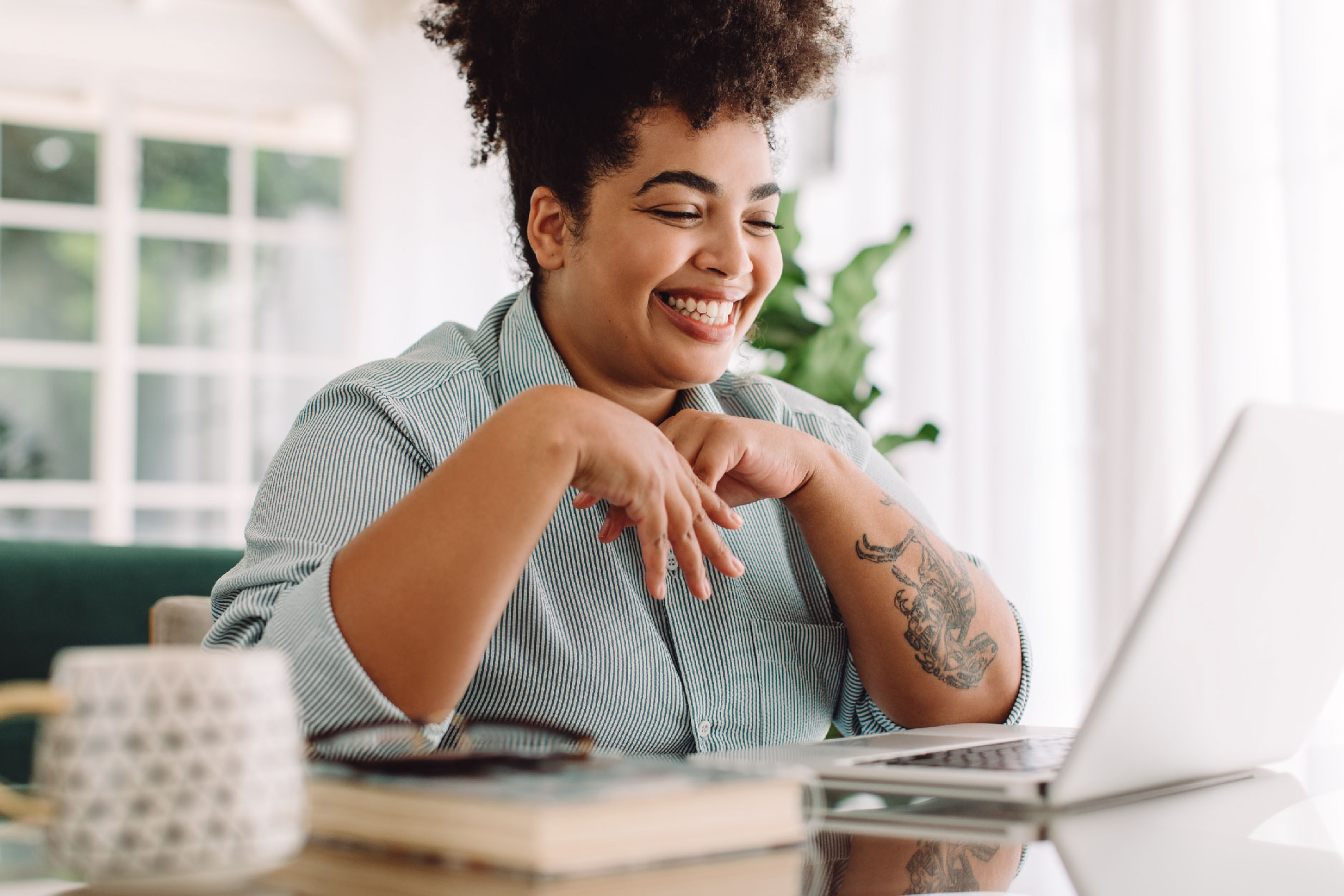 person-smiling-looking-on-group-therapy-zoom-call